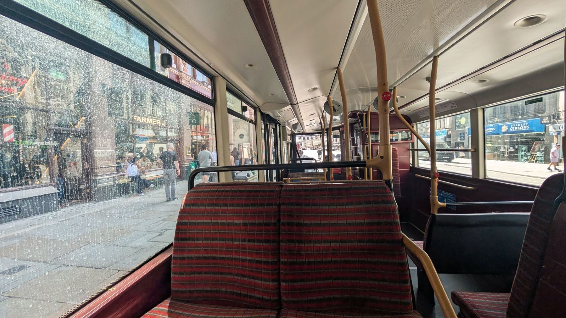 Bus seat on London double-decker for international transportation guides and tips