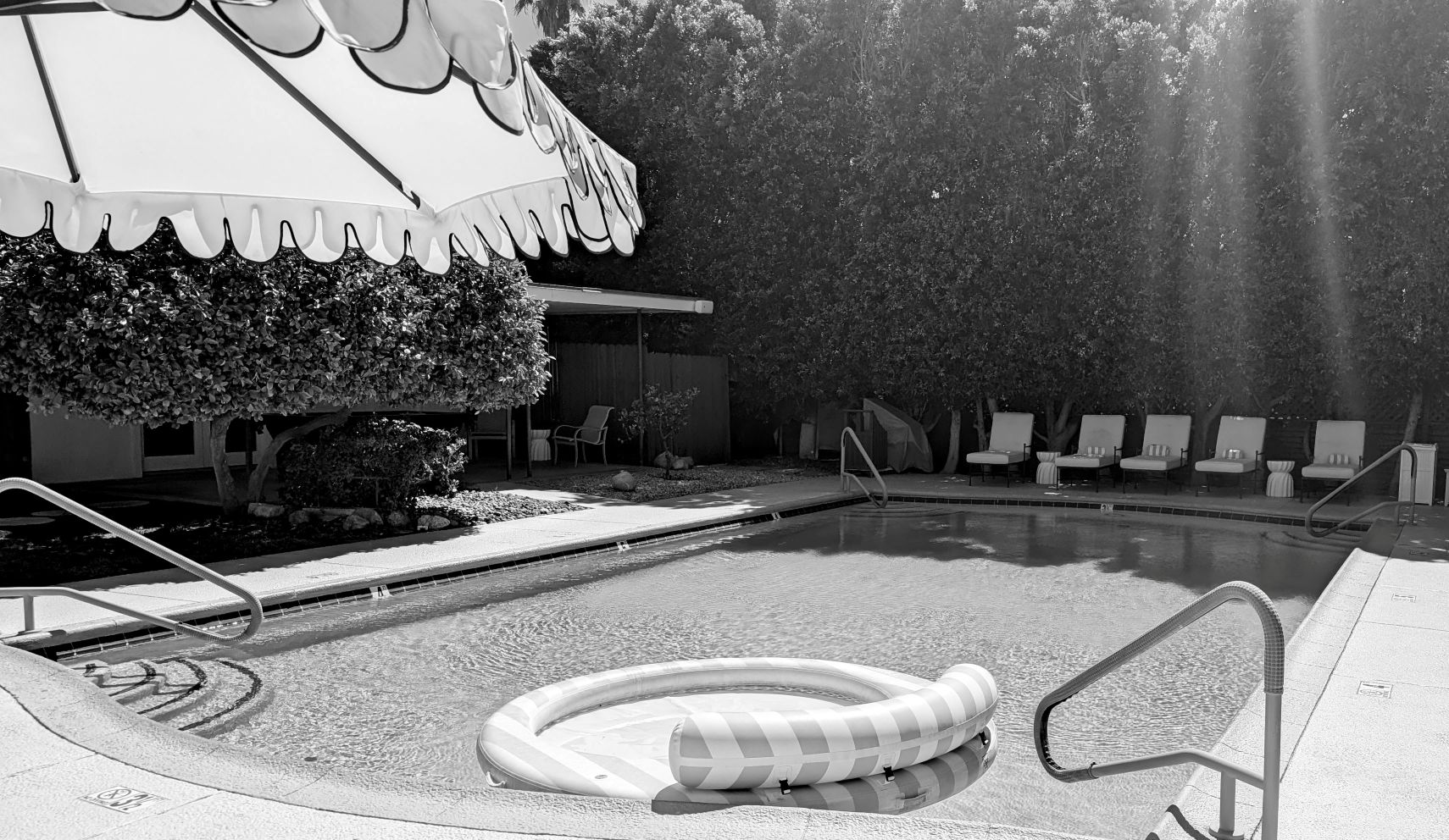 Funboy float on pool with sunshine