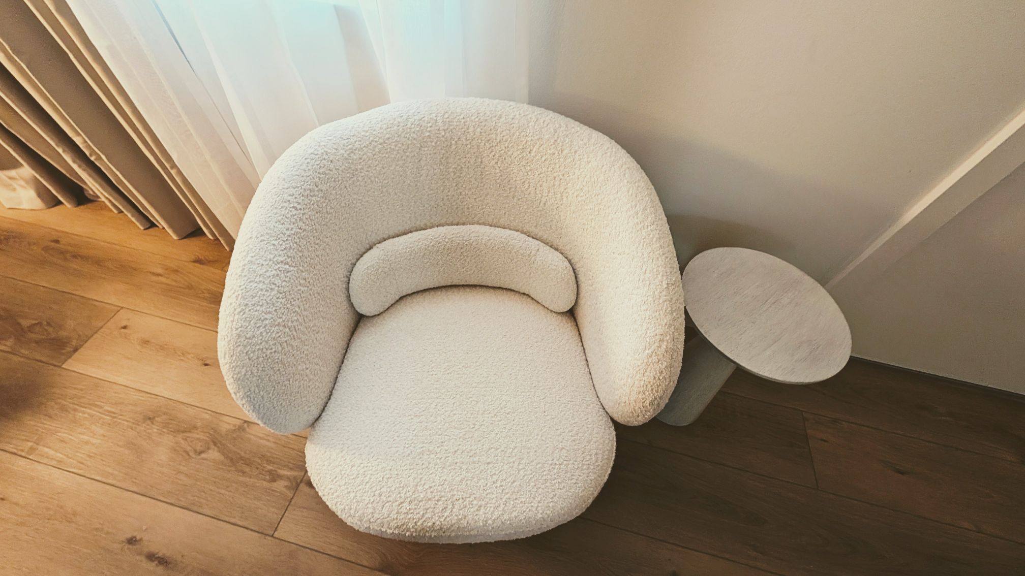 White round sofa in hotel room