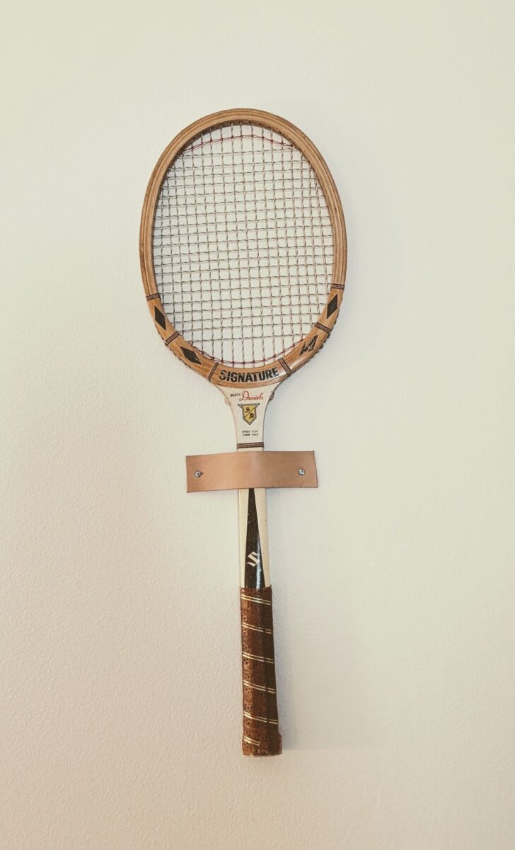 Vintage tennis racket hung on wall at Casa Palma Resort