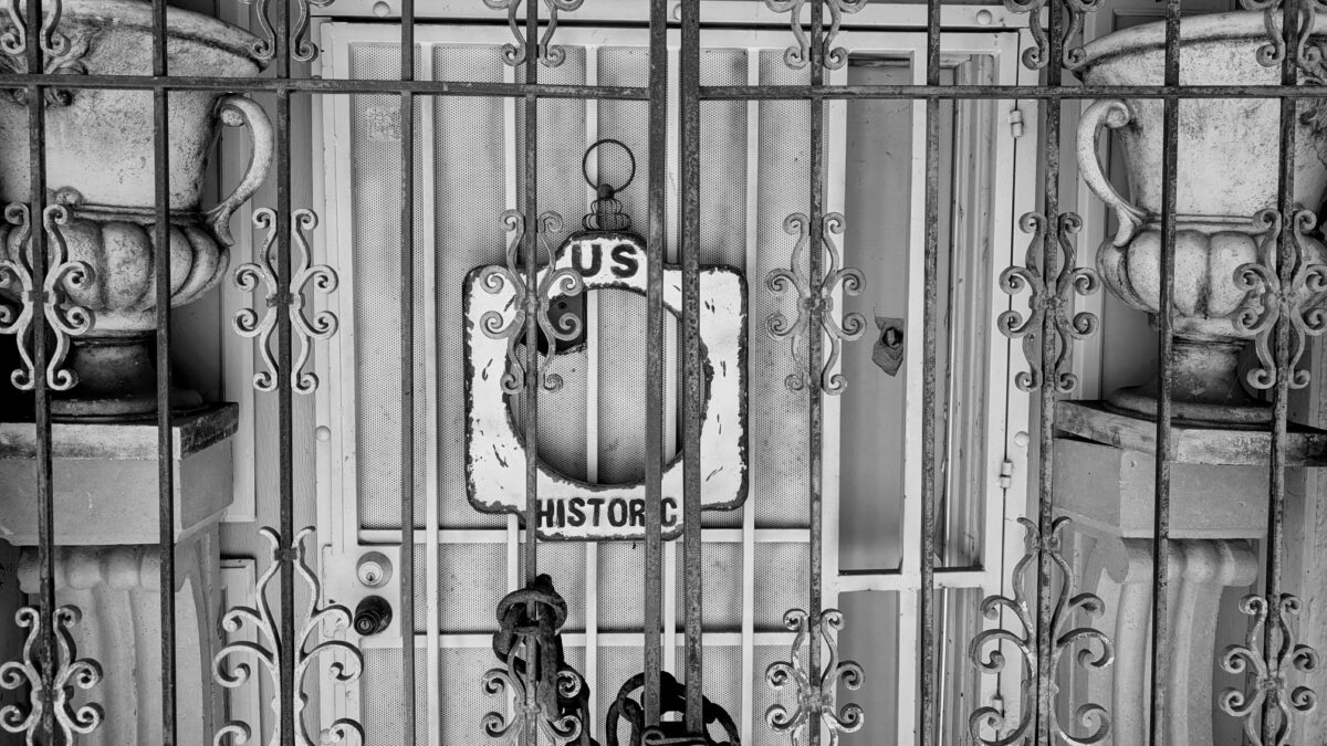 Black and white hotel door evoking travel fiascos