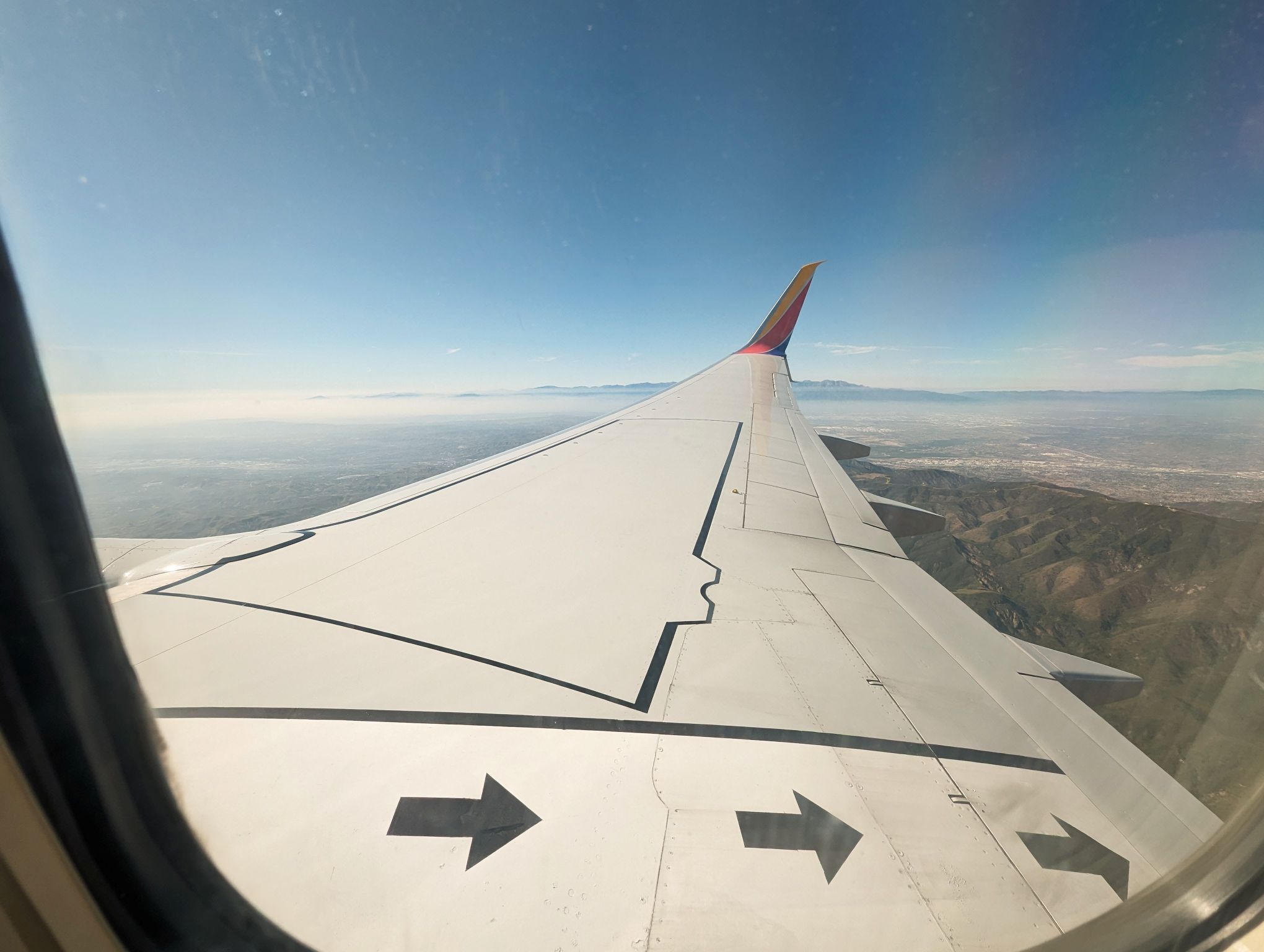 Plane wing flying into Long Beach Airport