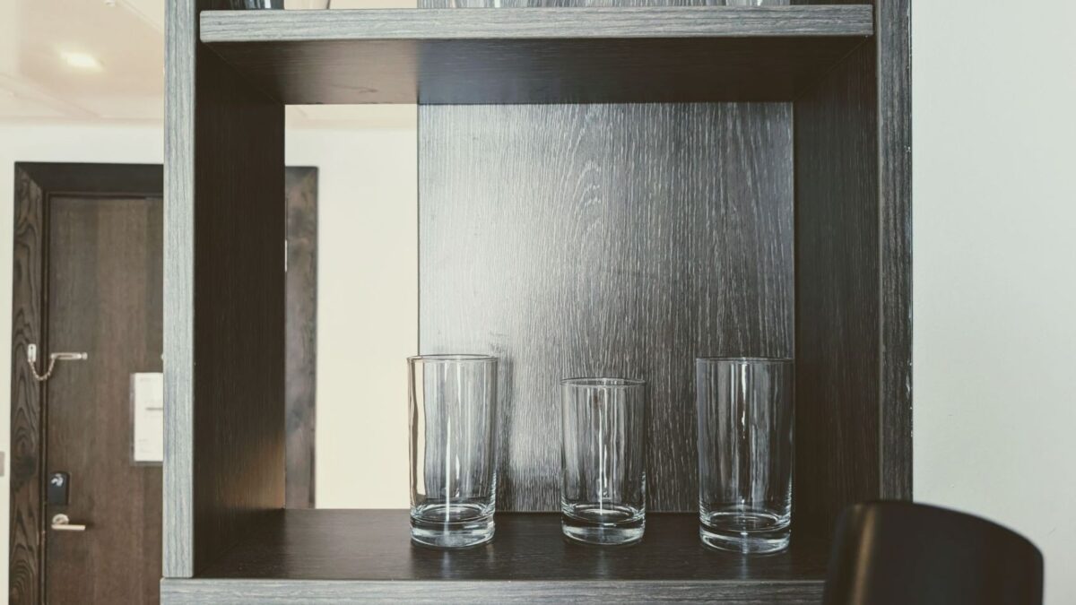 Cups on a shelf in a hotel