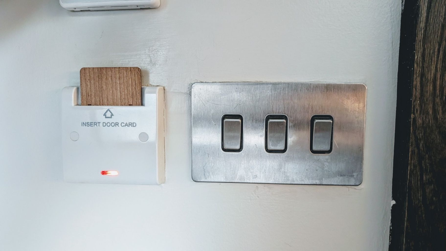 Panel with light switches and room keycard electricity master control